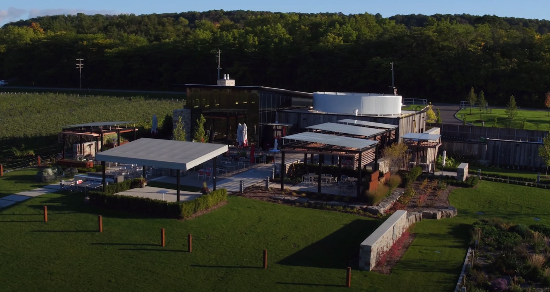 Commercial Landscaping and Lawn Maintenance Services Commercial landscaping project showing modern outdoor building design with extensive lawn areas and professional maintenance